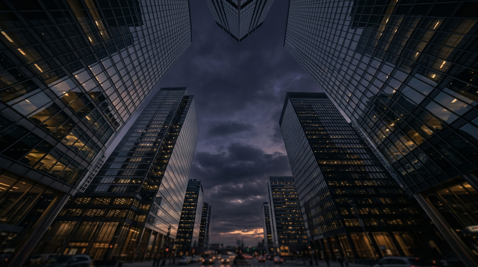 Modern glass skyscrapers at twilight representing Tier-1 institutional commercial capital and expedited funding solutions by Kaizen Business Credit.